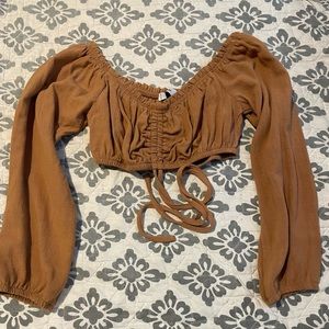 It’s from Adika, It’s an off the shoulder crop top in a size Small